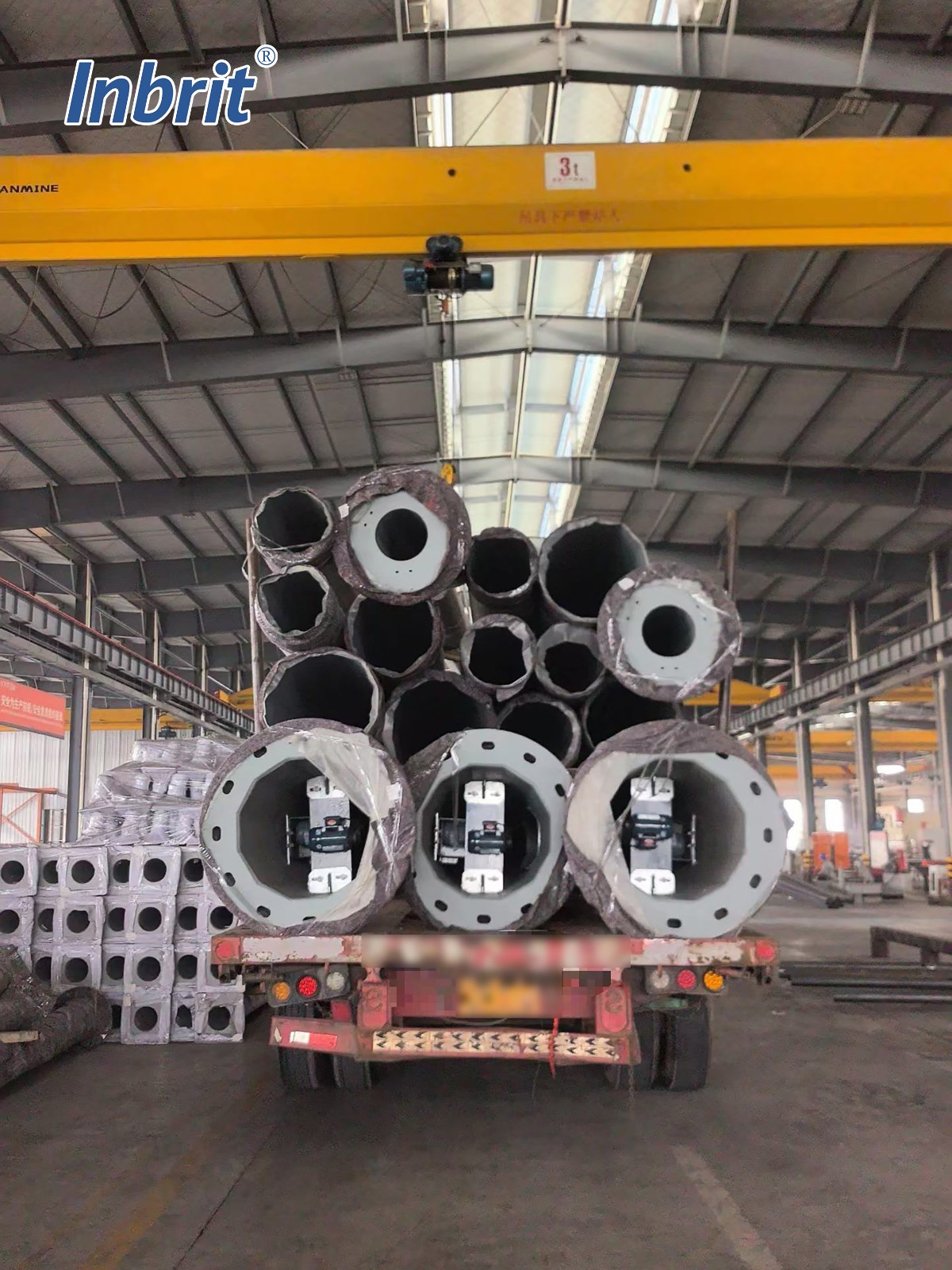 Sectional high mast light poles prepared for shipment at the Inbrit factory Sectional high mast light poles prepared for shipment at the Inbrit factory
